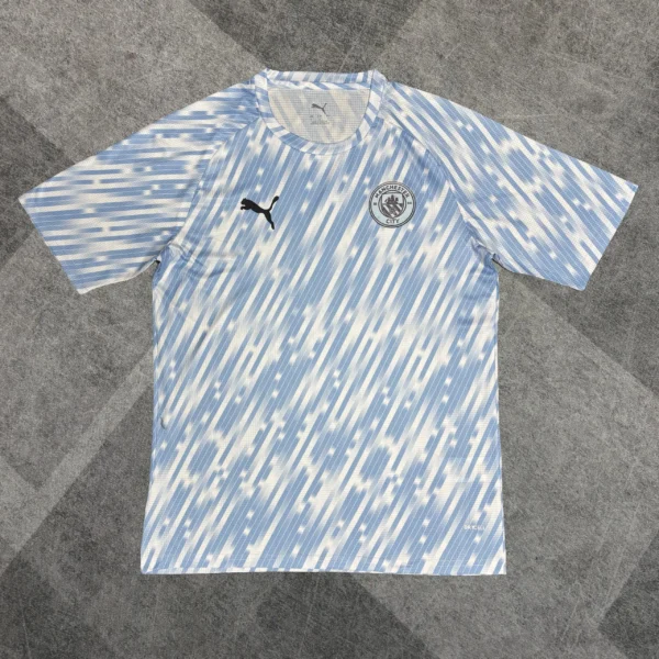 Maillot Manchester City Avant-Match Tacheté 2025/2026 — devant Maillot Manchester City Avant-Match Tacheté 2025/2026 — devant